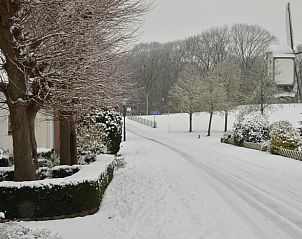 Snowy landscape around Holiday home in Melick, Central Limburg with winter charm.