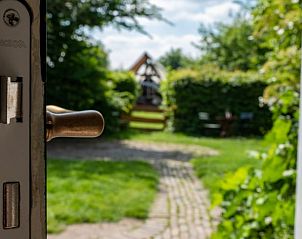 View of the garden from Holiday Home in De Heen, West Brabant, North Brabant.
