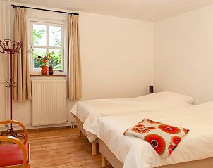 Sfeervolle slaapkamer in Vakantiehuis in Zegge, ideaal voor een rustige vakantie in Zegge, West Brabant.