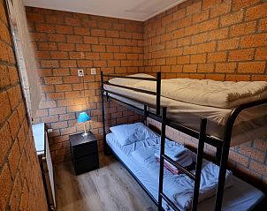 Knusse slaapkamer met stapelbed in vakantiehuis De Blenck 21, Callantsoog, perfect voor een gezinsvakantie aan zee.