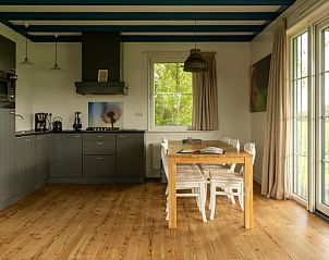 Enjoy the modern kitchen and dining area at Holiday Home in Schellinkhout, perfect for a relaxing stay on the IJsselmeer coast.