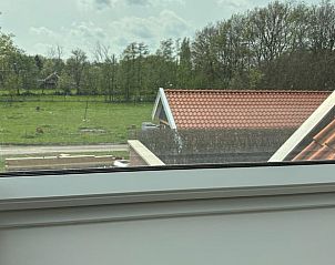 View from the bedroom of Cottage in Enschede, vacation accommodation in Twente.