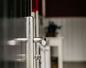 Open door to Holiday home in Olst, a cozy vacation home in Salland, Overijssel.