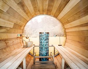 Unique sauna experience in Holiday Home in Diepenveen, with wooden interior and views of Salland nature.