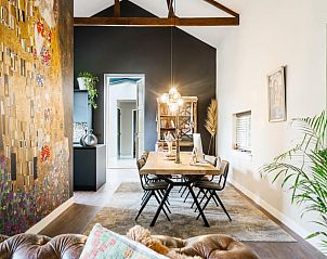 Dining Room in Holiday Home in Diepenveen with artistic wall decorations and modern furnishings in Salland, Overijssel.
