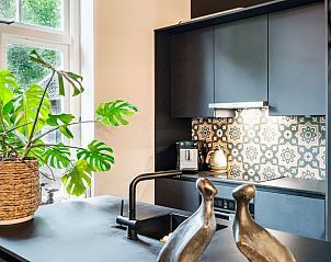 Modern kitchen in Holiday home in Diepenveen with stylish tiles and lots of natural light in Overijssel.