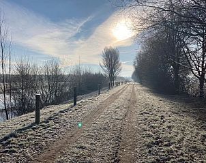 Breathtaking sunset over the fields at Holiday Home in Giethmen, Vechtstreek, Overijssel, with colorful sky.