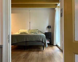 Comfortabele slaapkamer in Vakantiehuis in Nigtevecht, Utrecht met serene atmosfeer.