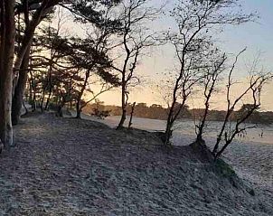 Zandverstuiving bij zonsondergang nabij Oak Valley 15 vakantiehuis, Soesterberg, Utrecht noord.