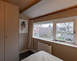 Open deur naar woonkamer in vakantiehuis UT072, Austerlitz.