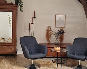 Stijlvolle zithoek in Vakantiehuisje in Dreischor, Schouwen-Duiveland, Zeeland met moderne inrichting.