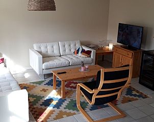 Gezellige woonkamer met zithoek in Vakantiehuis Joossesweg 191, Westkapelle, Walcheren, Zeeland.