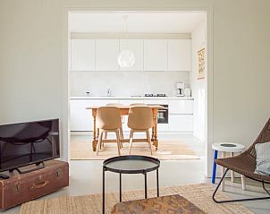 Modern dining and living room in Cottage in Philippine, cottage in Zeeuws-Vlaanderen, with open kitchen.