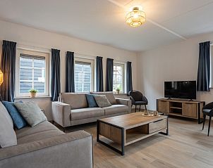 Gezellige woonkamer van Vakantiewoning Knuitershoek 102 in Ossenisse, Zeeuws-Vlaanderen.