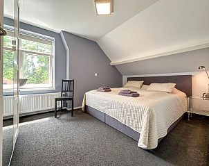 Spacious bedroom in Bronzigt, Terneuzen with large windows and lots of light.