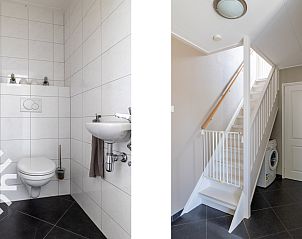 Sfeervolle tweede slaapkamer in vakantiehuis ZE207, Oud Sabbinge, met uniek bloemenbehang.