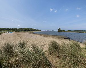 Prachtig uitzicht op het strand nabij Vakantiehuis Haus Anni in Hansweert, Zuid-Beveland, Zeeland.