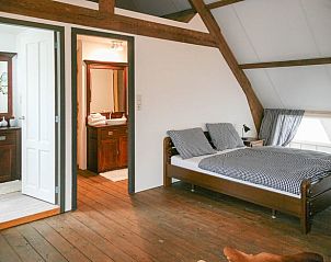Cozy bedroom with double bed in vacation home Stolwijk, Alblasserwaard, South Holland.