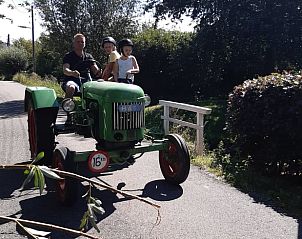 Tractor ride with children near vacation home Stolwijk, Alblasserwaard, South Holland.