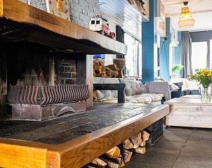 Cozy living room with fireplace in De Kaag Watersport Group accommodation, vacation home in Kaag, Green Heart, South Holland.