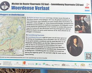 Informatiebord over Woerdense Verlaat, ontdek de rijke geschiedenis van het Groene Hart, Zuid-Holland.